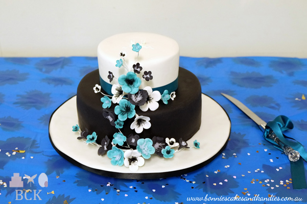 Timara's & Kane's black and white engagement cake with black, white & blue flower paste blossoms | Bonnie's Cakes & Kandies, Gympie.