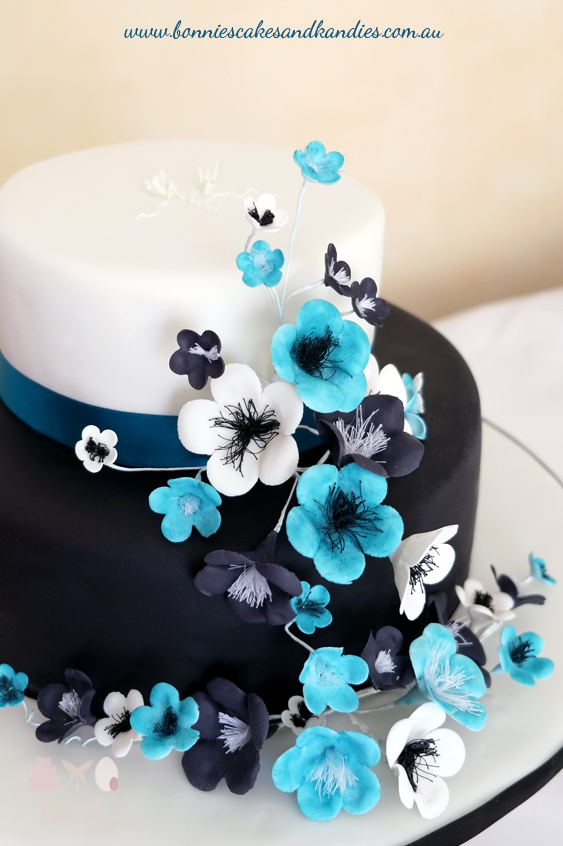 Timara & Kane's black and white engagement cake was brought to life with pops of blue | Bonnie's Cakes & Kandies, Gympie.