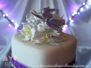 Purple butterflies, white Singapore orchids, rosebuds and leaves  |  Bonnie's Cakes & Kandies, Gympie.