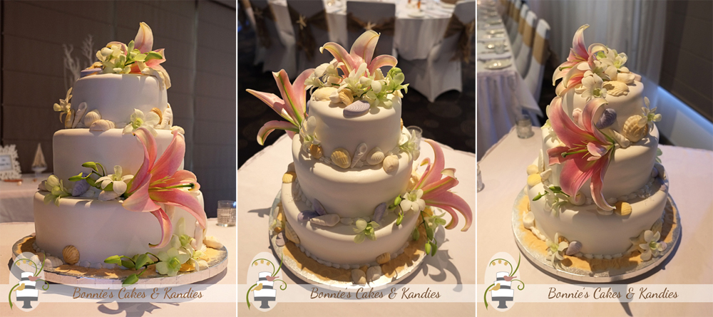 Edible seashells and fresh Oriental lilies and Singapore orchids decorated this beach-themed wedding cake | Bonnie's Cakes & Kandies