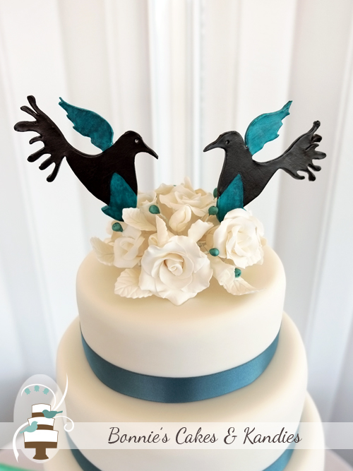 Custom made lovebird cake toppers were match to the wedding invitations to tie in the lovebirds theme  |  Bonnie’s Cakes & Kandies