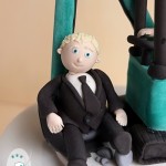 ‘Scooped’ off his feet by this custom made digger wedding cake topper!