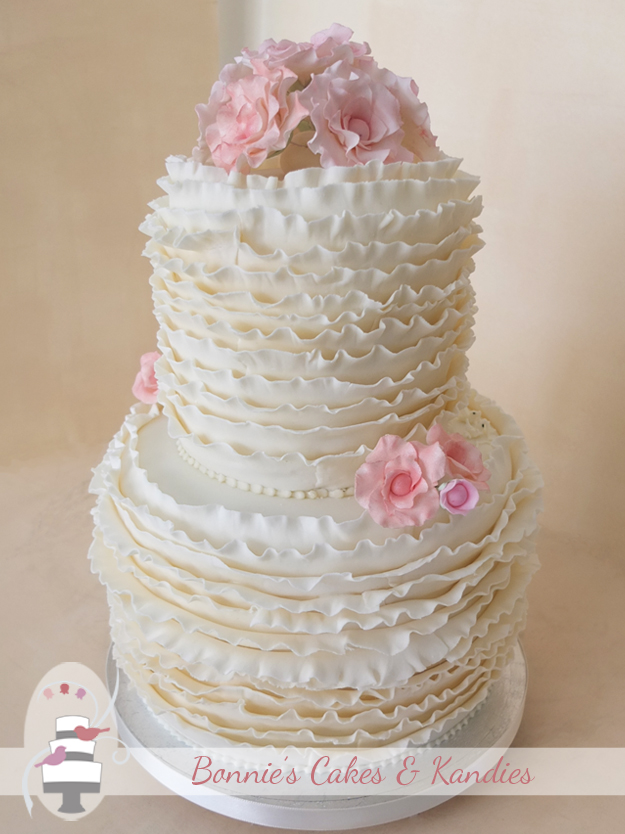 Gold Coast wedding cake with ivory ruffles and fantasy flowers in shades of pink - Bonnie’s Cakes & Kandies, Gympie
