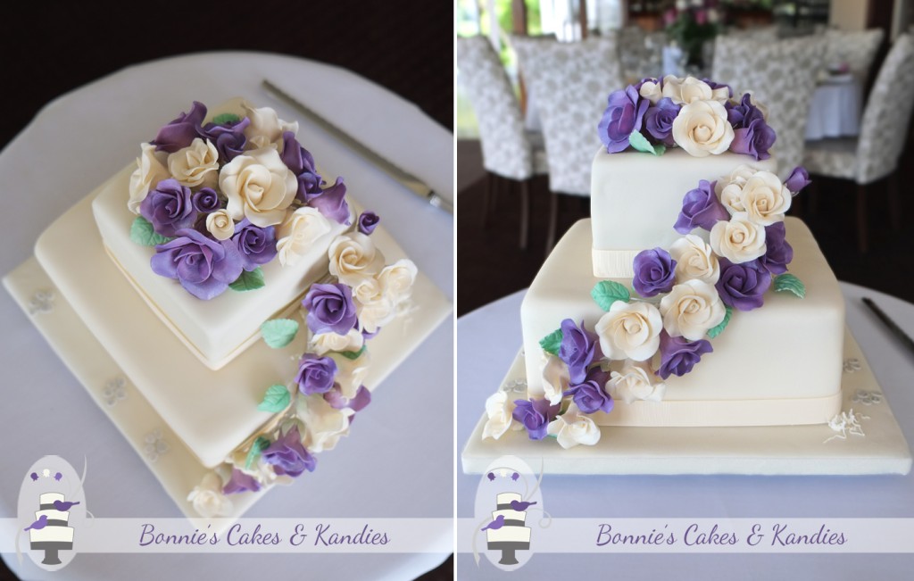A full posy and cascade of purple and ivory icing roses, with subtle silver paw prints decorated this Maleny Manor wedding cake  |  Bonnie’s Cakes & Kandies